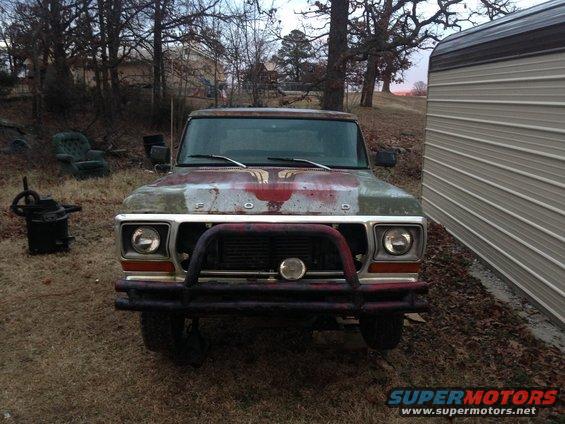 1978 Ford Bronco front view with brush guard and faded paint
