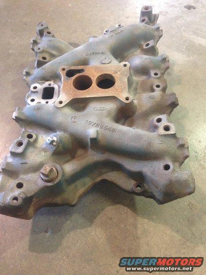 Ford intake manifold with part number 19728548 visible
