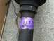 2003 Ford Taurus - Close-up of a purple label on an automotive part, showing part numbers and 'RIGHT'.