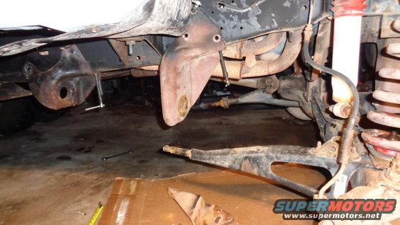 Close-up of rusty suspension parts and brake lines