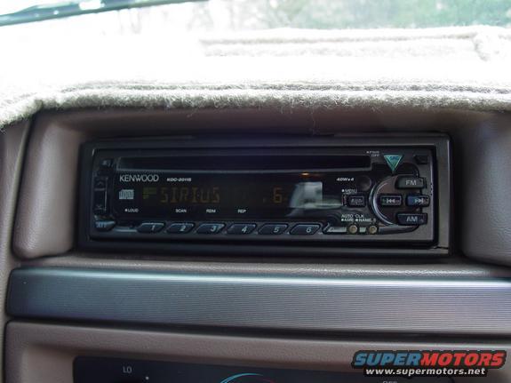 Dashboard shot of a Kenwood radio displaying "SIRIUS" and the number 6