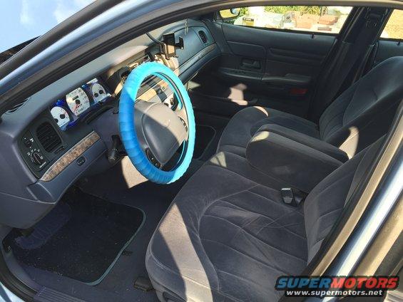 1994 Ford Crown Victoria interior with blue steering wheel cover and grey seats