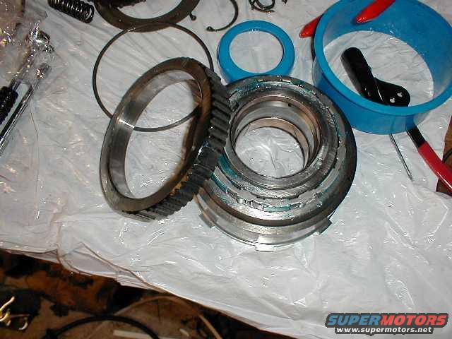 This is the intermediate sprag (also called the intermediate one-way roller clutch) that locks during 2nd gear, and it sits on top of the reverse drum.