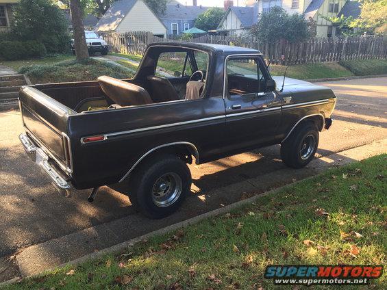 Black 1978 Ford Bronco parked curbside, viewed from the 3/4 front