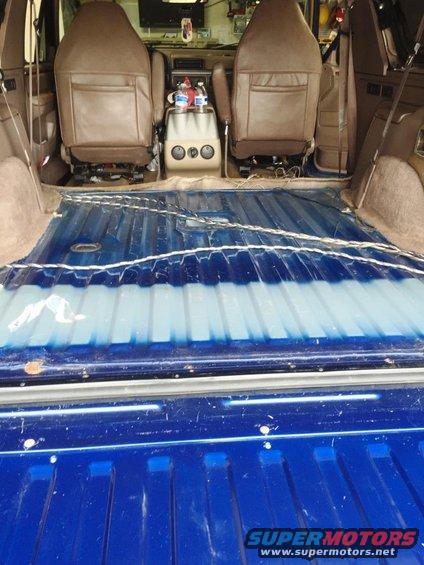 1996 Ford Bronco interior, showing front seats and blue cargo area