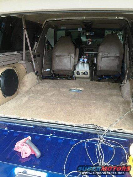 1996 Ford Bronco interior cargo area with tan carpet and brown seats