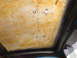 1964 Volkswagen Beetle - The interior headliner shows signs of wear with yellowed insulation and exposed mounting points.