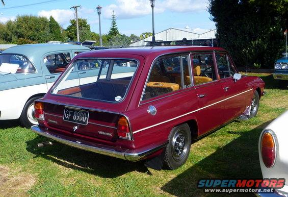 Red station wagon rear view with license plate GF 8950