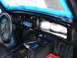 1964 Volkswagen Beetle - The interior of a 1964 Volkswagen Beetle shows the dashboard with blue tape applied around the windshield area.