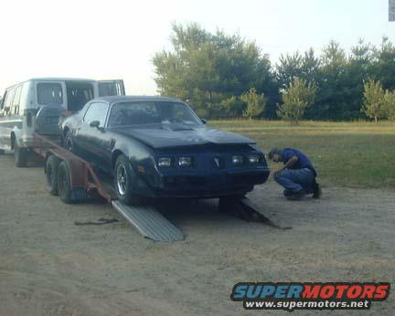my dad helping me unload my new parts car