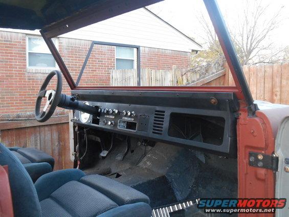 1972 Ford Bronco interior with blue seats and dashboard