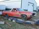 1971 Ford Ranchero - Red pickup truck on a trailer, showing its front and side profile. The vehicle appears to be a 1970s model.