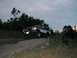 1994 Ford Bronco - This two-tone Ford Bronco is captured in a three-quarter front view as it ascends a dirt incline.