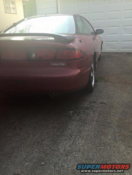 Red MazdaSpeed coupe rear with spoiler and taillights