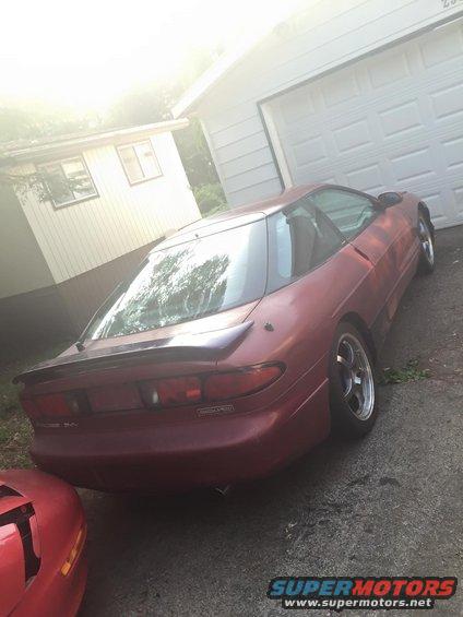 Red 1995 Ford Probe rear view