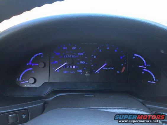 dashboard gauges with odometer showing 225780 miles and speedometer reading about 35 mph