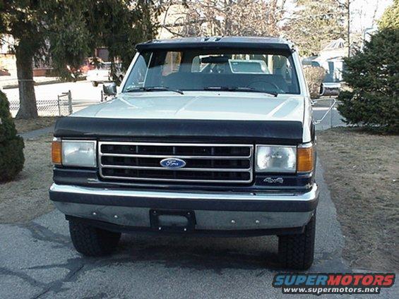 1993 Ford Bronco front view with black bug deflector and sun visor