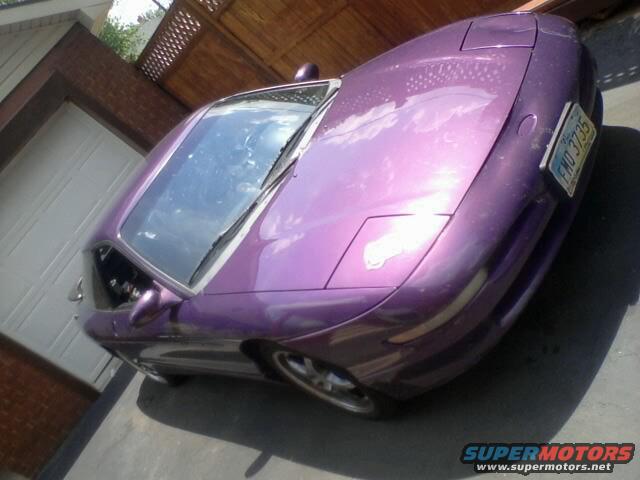 Purple 1995 Ford Probe parked in driveway