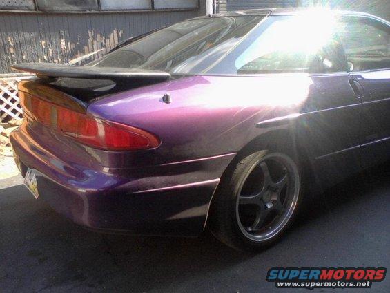 Purple 1995 Ford Probe with a rear spoiler, viewed from the rear quarter