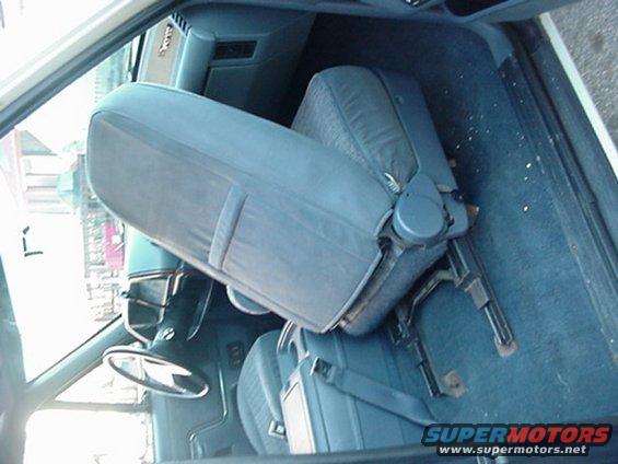 1993 Ford Bronco interior with blue cloth seats and dashboard