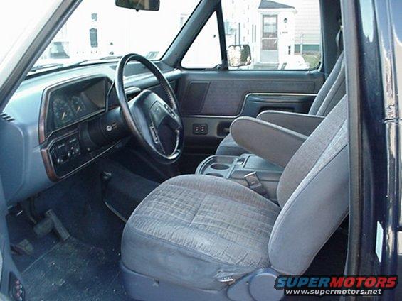 Interior of 1993 Ford Bronco showing front seats, dashboard, and steering wheel