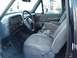 1993 Ford Bronco - The interior of a 1993 Ford Bronco features cloth seats, a dashboard with gauges, and a steering wheel.