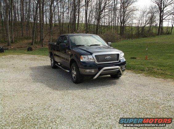 Dark blue 2005 Ford F-150 pickup truck with chrome bull bar