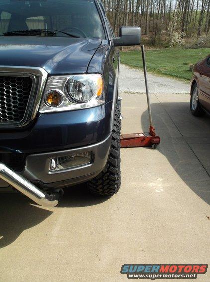 Blue 2005 Ford F-150 front quarter view with large tires