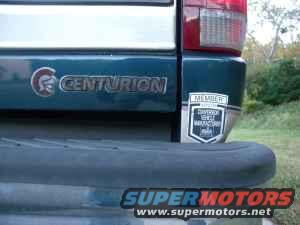 Vehicle rear bumper with 'CENTURION' badge and 'MEMBER' sticker. Supermotors.net logo visible