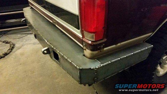 Custom metal rear bumper with tow hitch receiver and D-ring mounts