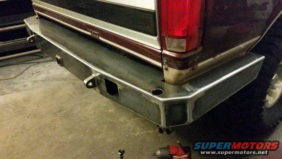 Custom steel rear bumper with integrated tow hitch receiver and D-ring mounts