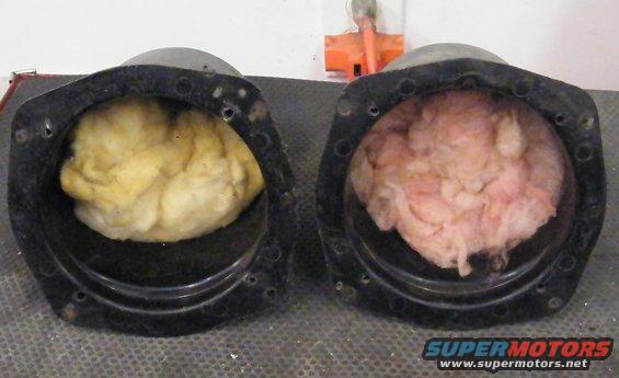 Two black circular housings, each with insulation inside. One has yellow insulation, the other pink