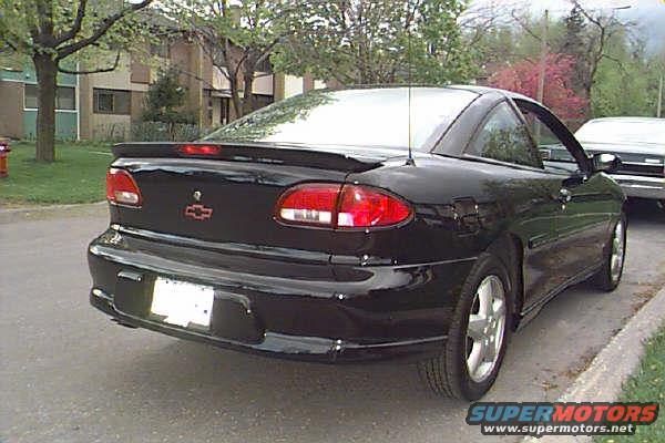 black Chevrolet Cavalier coupe parked on street, another car behind it