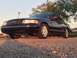 2008 Ford Crown Victoria - Black 2008 Ford Crown Victoria seen from a low angle on a gravel surface.