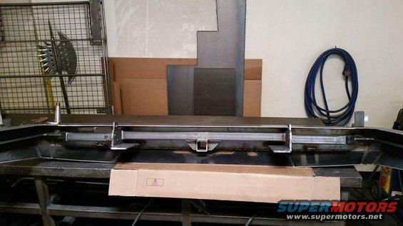 Rear bumper assembly with hitch receiver