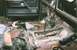 1978 Ford Bronco - The interior of a vehicle shows significant rust on the floor and is cluttered with tools, suggesting a restoration project is underway.
