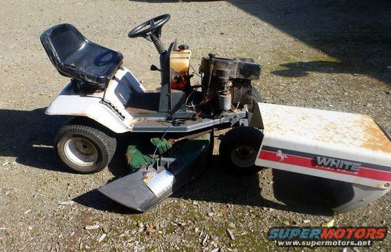 White riding lawn mower with red stripe and 'WHITE' text on the hood