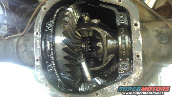 4.jpg inside the diff when i pulled the cover. carrier, spiders ring and pinion are all toast. but i might save this axle for a future use and rebuild it