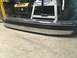 1993 Ford Bronco - Chrome bumper with black trim, likely for an older truck or SUV, seen indoors.