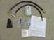 2007 Ford F-250 - A coolant filter kit is laid out with hoses and a document.