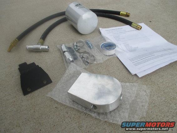 Coolant filter kit with hoses, fittings, bracket, and instructions