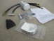 2007 Ford F-250 - Parts laid out for a coolant filter installation kit, including a Wix filter and various fittings.
