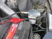 2007 Ford F-250 - Close-up view of an engine bay, highlighting a coolant filter and battery.