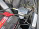 2007 Ford F-250 - Close-up view of a coolant filter assembly and battery in an engine bay.