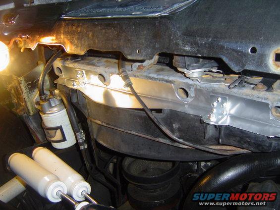 Gap filler in place. It attaches to the lower core support with six sheet metal screws and to the fan shroud with two 1/4" bolts with nyloc nuts. There is still a small gap where the notch is in the shroud, I will fill this and the two notches on the side of the shroud at a later date.