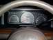 2003 Ford Crown Victoria - The interior of a vehicle shows the dashboard gauges, including the speedometer, fuel, volts, and temperature readings.