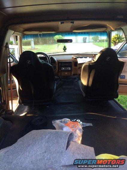 1990 Ford Bronco interior with black seats and tan dashboard
