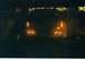 1988 Ford Bronco - Two vehicles are visible at night, with their headlights and taillights illuminated, creating an abstract scene.