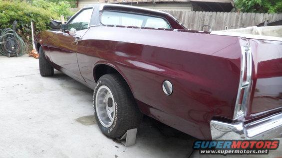 Maroon 1972 Ford Ranchero parked on concrete, rear quarter view