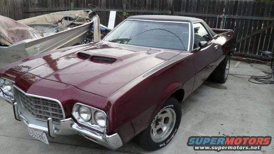 Maroon 1972 Ford Ranchero with hood scoops and aftermarket wheels
